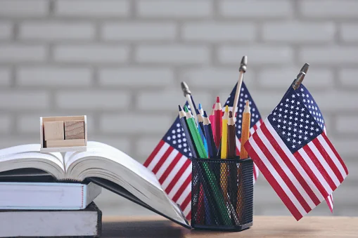 Books, pencils, and small American flags